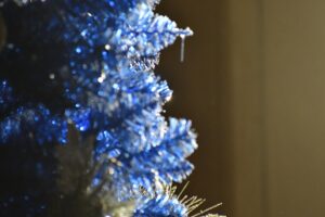 a close up of a blue christmas tree